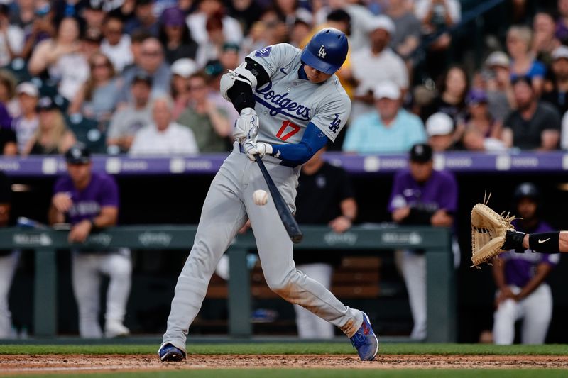 Jun 17, 2024; Denver, Colorado, USA; Los Angeles Dodgers designated hitter Shohei Ohtani (17) hits a double in the sixth inning against the Colorado Rockies at Coors Field. Mandatory Credit: Isaiah J. Downing-USA TODAY Sports