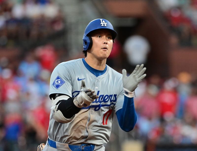 Aug 17, 2024; St. Louis, Missouri, USA;  Los Angeles Dodgers designated hitter Shohei Ohtani (17) celebrates after he hit a solo home run against the St. Louis Cardinals in the fifth inning at Busch Stadium. Mandatory Credit: Tim Vizer-USA TODAY Sports