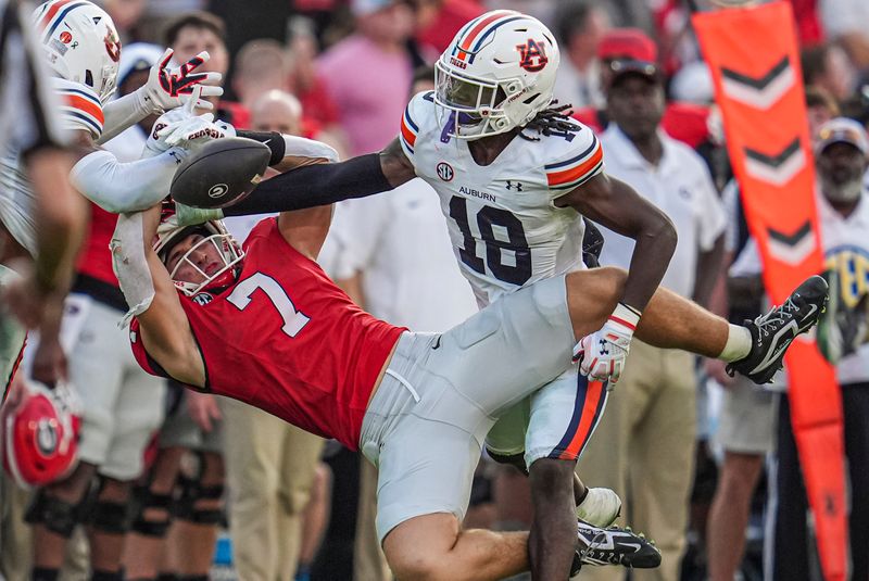 Oct 5, 2024; Athens, Georgia, USA; Georgia Bulldogs tight end Lawson Luckie (7) tries to make a catch against Auburn Tigers safety Kaleb Harris (18) at Sanford Stadium. Mandatory Credit: Dale Zanine-Imagn Images