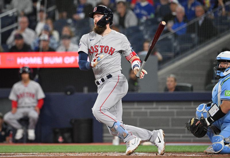 Sep 24, 2024; Toronto, Ontario, CAN; Boston Red Sox shortstop Trevor Story (10) hits a double against the Toronto Blue Jays in the second inning at Rogers Centre. Mandatory Credit: Dan Hamilton-Imagn Images