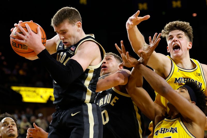 Feb 25, 2024; Ann Arbor, Michigan, USA;  Purdue Boilermakers guard Braden Smith (3) rebounds in the first half against the Michigan Wolverines at Crisler Center. Mandatory Credit: Rick Osentoski-USA TODAY Sports