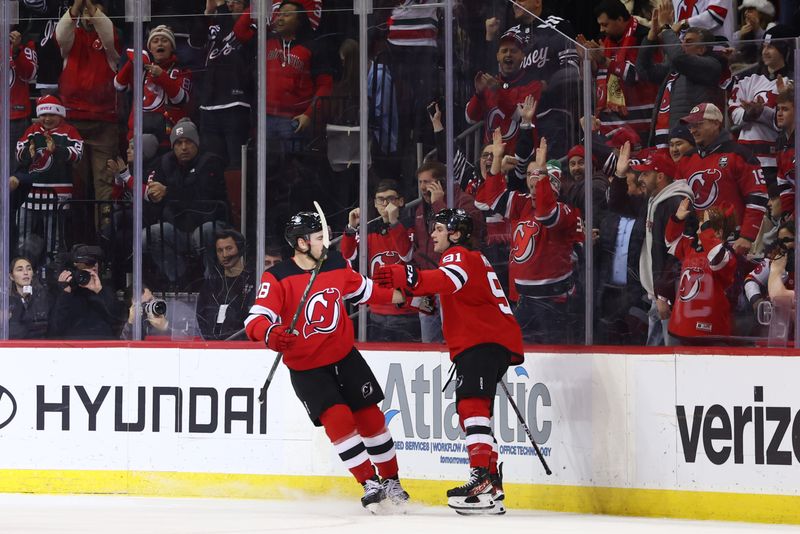 Dec 21, 2023; Newark, New Jersey, USA; New Jersey Devils center Dawson Mercer (91) celebrates his goal against the Edmonton Oilers during the first period at Prudential Center. Mandatory Credit: Ed Mulholland-USA TODAY Sports