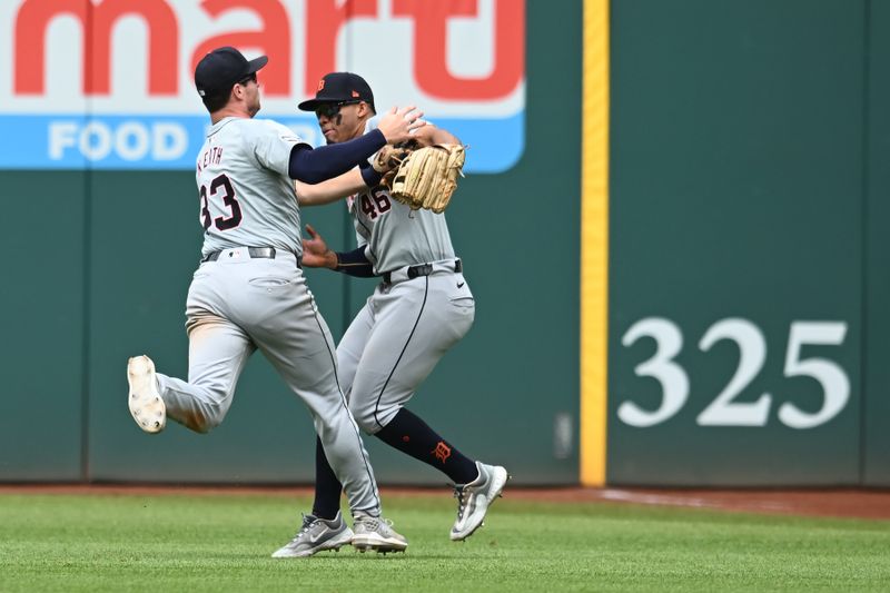 Jul 25, 2024; Cleveland, Ohio, USA; Detroit Tigers second baseman Colt Keith (33) and right fielder Wenceel Perez (46) nearly collide while making the final out pf the game on a it by Cleveland Guardians hitter Will Brennan (not pictured) during the ninth inning at Progressive Field. Mandatory Credit: Ken Blaze-USA TODAY Sports