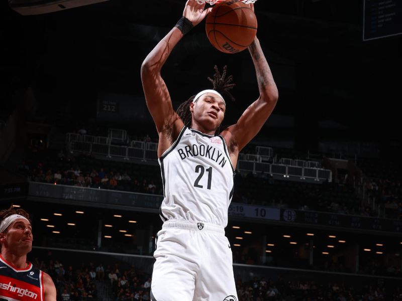 BROOKLYN, NY - OCTOBER 14: Noah Clowney #21 of the Brooklyn Nets dunks the ball during the game against the Washington Wizards during a NBA preseason game on October 14, 2024 at Barclays Center in Brooklyn, New York. NOTE TO USER: User expressly acknowledges and agrees that, by downloading and or using this Photograph, user is consenting to the terms and conditions of the Getty Images License Agreement. Mandatory Copyright Notice: Copyright 2024 NBAE (Photo by Nathaniel S. Butler/NBAE via Getty Images)