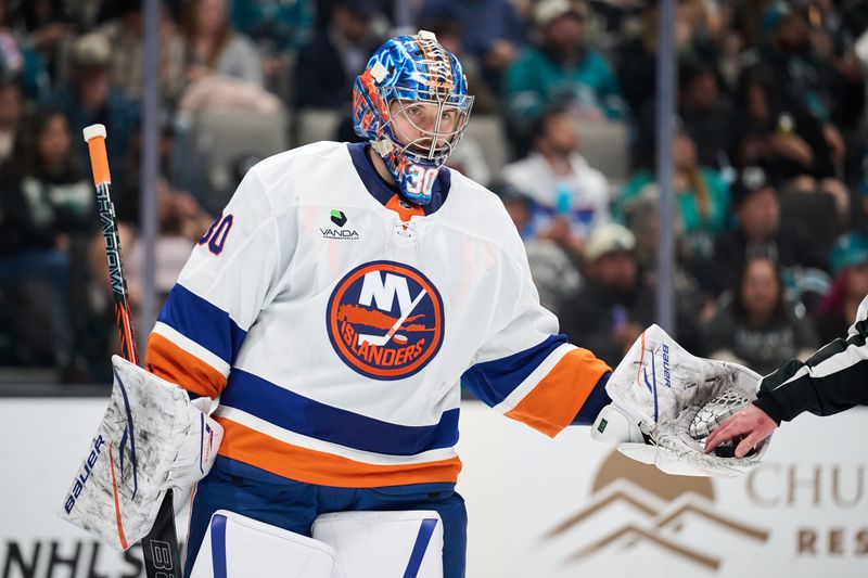 Mar 7, 2026; San Jose, California, USA; New York Islanders goaltender Ilya Sorokin (30) extends his glove with the puck for referee Graedy Hamilton (not pictured) during the second period against the San Jose Sharks at SAP Center at San Jose. Mandatory Credit: Robert Edwards-Imagn Images