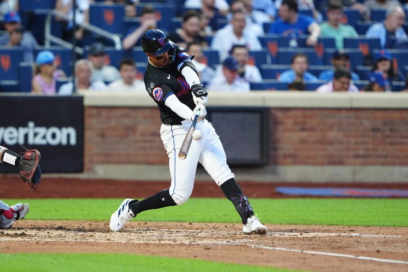 Jul 10, 2024; New York City, New York, USA; New York Mets third baseman Mark Vientos (27) hits a double against the Washington Nationals during the fourth inning at Citi Field. Mandatory Credit: Gregory Fisher-USA TODAY Sports