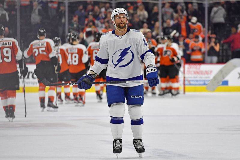 Feb 27, 2024; Philadelphia, Pennsylvania, USA; Tampa Bay Lightning center Luke Glendening (11) skates off the ice as Philadelphia Flyers celebrate win at Wells Fargo Center. Mandatory Credit: Eric Hartline-USA TODAY Sports