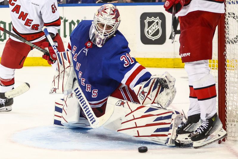 May 5, 2024; New York, New York, USA; New York Rangers goaltender Igor Shesterkin (31) makes a save in the third period against the Carolina Hurricanes in game one of the second round of the 2024 Stanley Cup Playoffs at Madison Square Garden. Mandatory Credit: Wendell Cruz-USA TODAY Sports