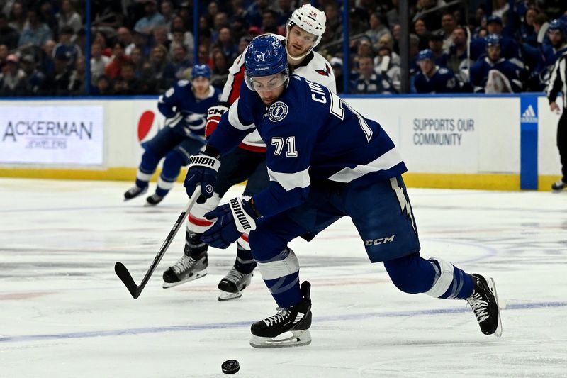 Mar 30, 2023; Tampa, Florida, USA; Tampa Bay Lightning center Anthony Cirelli (71) chases down the puck in the first period against the Washington Capitals at Amalie Arena. Mandatory Credit: Jonathan Dyer-USA TODAY Sports