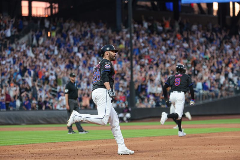 Jul 26, 2024; New York City, New York, USA; New York Mets designated hitter J.D. Martinez (28) celebrates after hitting a grand slam home run during the third inning against the Atlanta Braves at Citi Field. Mandatory Credit: Vincent Carchietta-USA TODAY Sports