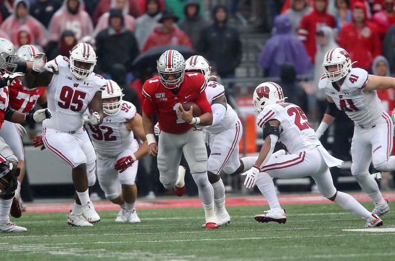 Oct 26, 2019; Columbus, OH, USA; Ohio State Buckeyes quarterback Justin Fields (1) runs during the first quarter against the Wisconsin Badgers at Ohio Stadium. Mandatory Credit: Joe Maiorana-USA TODAY Sports