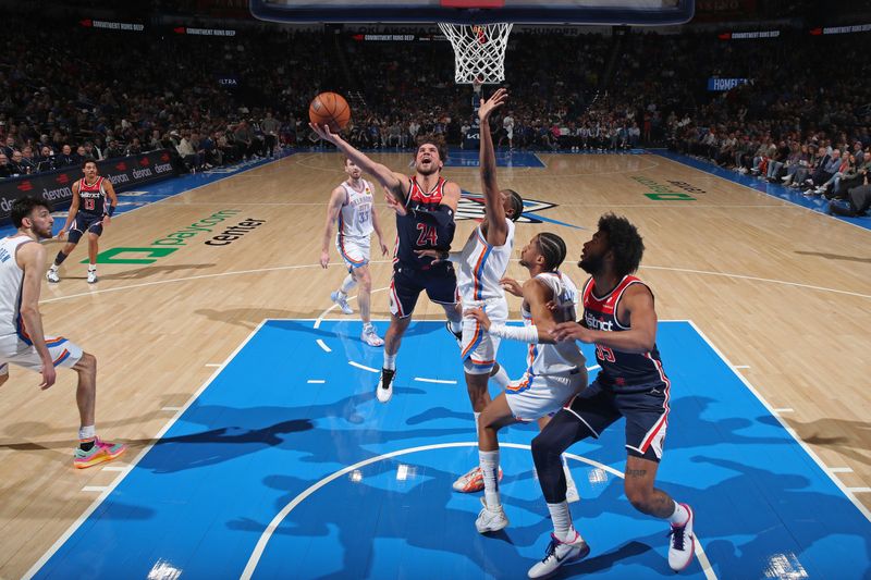 OKLAHOMA CITY, OK - FEBRUARY 23: Corey Kispert #24 of the Washington Wizards drives to the basket during the game against the Oklahoma City Thunder on February 23, 2024 at Paycom Arena in Oklahoma City, Oklahoma. NOTE TO USER: User expressly acknowledges and agrees that, by downloading and or using this photograph, User is consenting to the terms and conditions of the Getty Images License Agreement. Mandatory Copyright Notice: Copyright 2024 NBAE (Photo by Zach Beeker/NBAE via Getty Images)