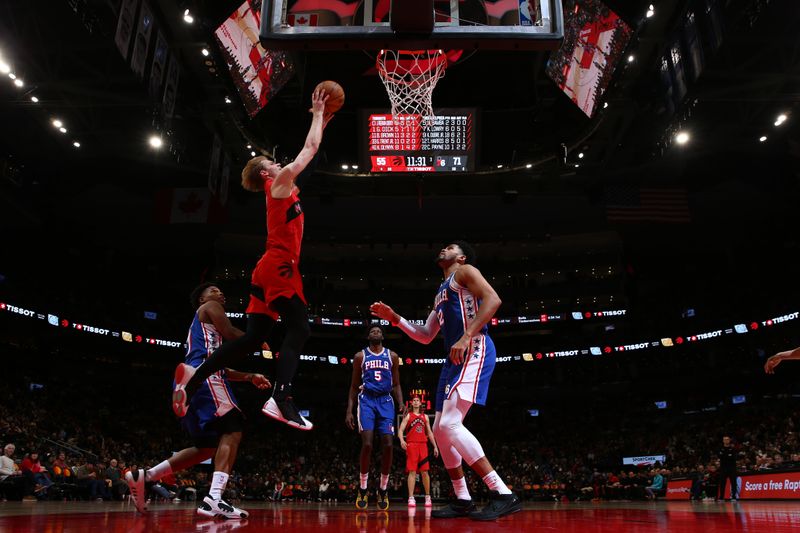 TORONTO, CANADA - MARCH 31: Gradey Dick #1 of the Toronto Raptors drives to the basket during the game  against the Philadelphia 76ers on March 31, 2024 at the Scotiabank Arena in Toronto, Ontario, Canada.  NOTE TO USER: User expressly acknowledges and agrees that, by downloading and or using this Photograph, user is consenting to the terms and conditions of the Getty Images License Agreement.  Mandatory Copyright Notice: Copyright 2024 NBAE (Photo by Vaughn Ridley/NBAE via Getty Images)