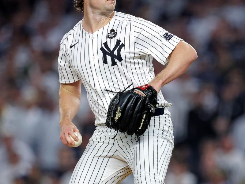 Oct 30, 2024; New York, New York, USA; New York Yankees pitcher Gerrit Cole (45) pitches during the first inning against the Los Angeles Dodgers in game four of the 2024 MLB World Series at Yankee Stadium. Mandatory Credit: Brad Penner-Imagn Images