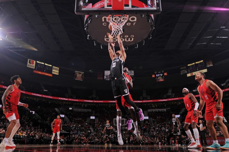 PORTLAND, OR - JANUARY 17: Nicolas Claxton #33 of the Brooklyn Nets rebounds the ball during the game against the Portland Trail Blazers on January 17, 2024 at the Moda Center Arena in Portland, Oregon. NOTE TO USER: User expressly acknowledges and agrees that, by downloading and or using this photograph, user is consenting to the terms and conditions of the Getty Images License Agreement. Mandatory Copyright Notice: Copyright 2024 NBAE (Photo by Cameron Browne/NBAE via Getty Images)