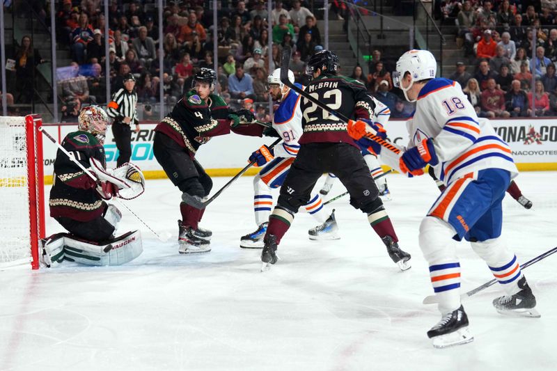 Feb 19, 2024; Tempe, Arizona, USA; Arizona Coyotes goalie Matt Villalta (31) makes a save against Edmonton Oilers left wing Zach Hyman (18) during the second period at Mullett Arena. Mandatory Credit: Joe Camporeale-USA TODAY Sports