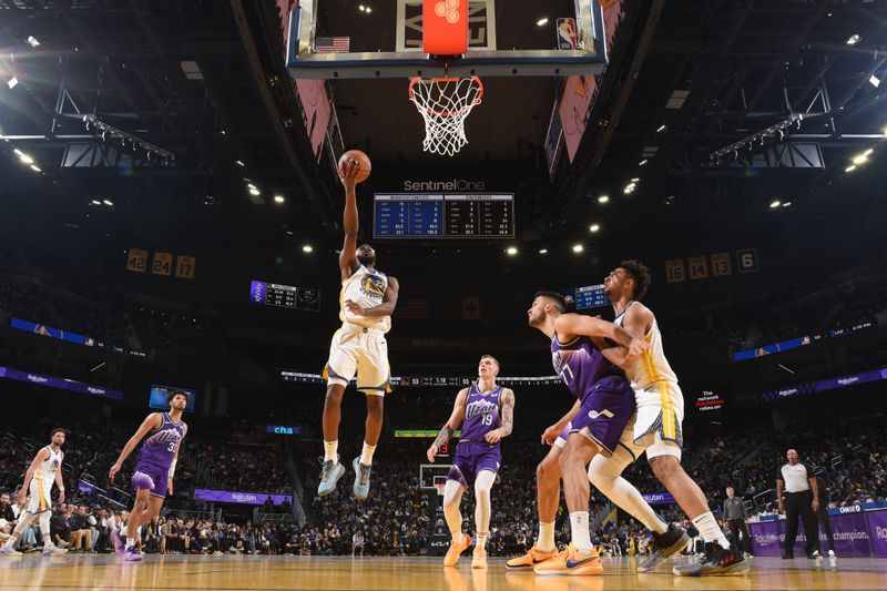 SAN FRANCISCO, CA - APRIL 14: Andrew Wiggins #22 of the Golden State Warriors drives to the basket during the game against the Utah Jazz on April 14, 2024 at Chase Center in San Francisco, California. NOTE TO USER: User expressly acknowledges and agrees that, by downloading and or using this photograph, user is consenting to the terms and conditions of Getty Images License Agreement. Mandatory Copyright Notice: Copyright 2024 NBAE (Photo by Noah Graham/NBAE via Getty Images)