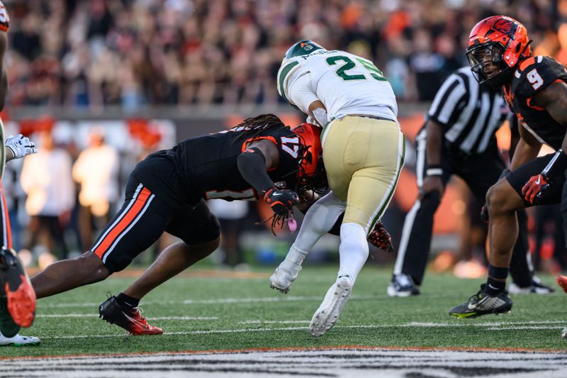 Oct 5, 2024; Corvallis, Oregon, USA; Oregon State Beavers defensive back Skyler Thomas (17) tackles Colorado State Rams running back Avery Morrow (25) during the second half at Reser Stadium. Mandatory Credit: Craig Strobeck-Imagn Images