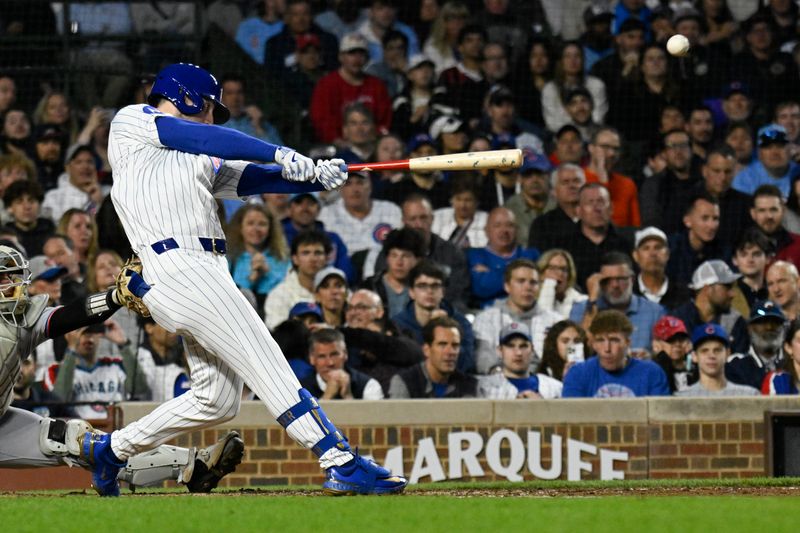 May 12, 2025; Chicago, Illinois, USA;  Chicago Cubs outfielder Kyle Tucker (30) hits an RBI triple against the Miami Marlins during the fifth inning at Wrigley Field. Mandatory Credit: Matt Marton-Imagn Images