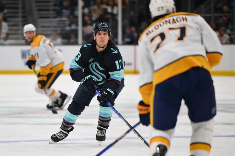 Mar 16, 2024; Seattle, Washington, USA; Seattle Kraken left wing Brandon Tanev (13) defends Nashville Predators defenseman Ryan McDonagh (27) during the second period at Climate Pledge Arena. Mandatory Credit: Steven Bisig-USA TODAY Sports