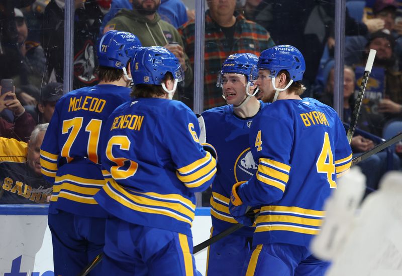 Jan 14, 2026; Buffalo, New York, USA;  Buffalo Sabres right wing Jack Quinn (22) celebrates his goal with teammates during the second period against the Philadelphia Flyers at KeyBank Center. Mandatory Credit: Timothy T. Ludwig-Imagn Images