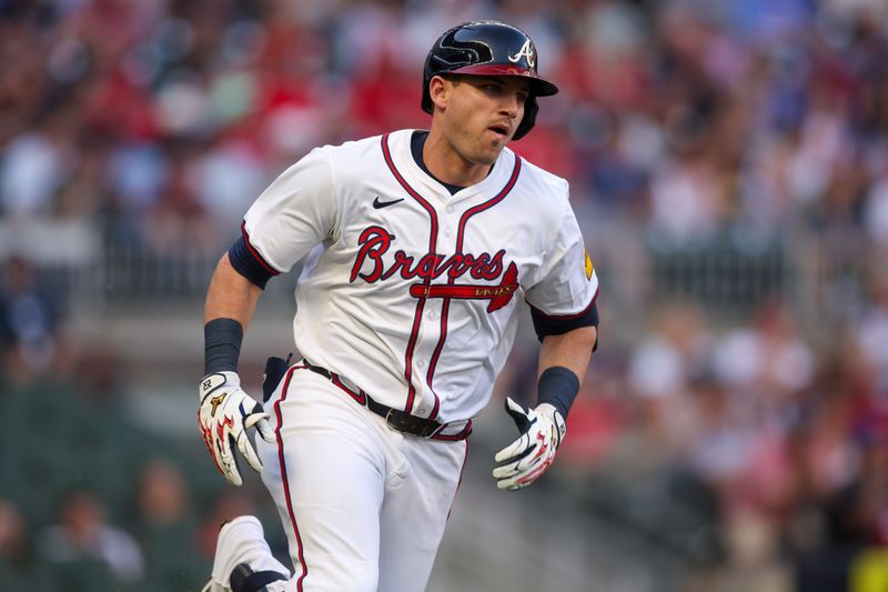 May 8, 2025; Atlanta, Georgia, USA; Atlanta Braves third baseman Austin Riley (27) hits a double against the Cincinnati Reds in the first inning at Truist Park. Mandatory Credit: Brett Davis-Imagn Images
