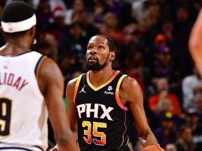 PHOENIX, AZ - DECEMBER 1: Kevin Durant #35 of the Phoenix Suns dribbles the ball during the game against the Denver Nuggets on December 1, 2023 at Footprint Center in Phoenix, Arizona. NOTE TO USER: User expressly acknowledges and agrees that, by downloading and or using this photograph, user is consenting to the terms and conditions of the Getty Images License Agreement. Mandatory Copyright Notice: Copyright 2023 NBAE (Photo by Barry Gossage/NBAE via Getty Images)