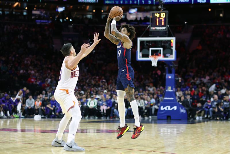 PHILADELPHIA, PENNSYLVANIA - NOVEMBER 04: Kelly Oubre Jr. #9 of the Philadelphia 76ers shoots over Grayson Allen #8 of the Phoenix Suns during the second quarter at the Wells Fargo Center on November 04, 2023 in Philadelphia, Pennsylvania. NOTE TO USER: User expressly acknowledges and agrees that, by downloading and or using this photograph, User is consenting to the terms and conditions of the Getty Images License Agreement. (Photo by Tim Nwachukwu/Getty Images)