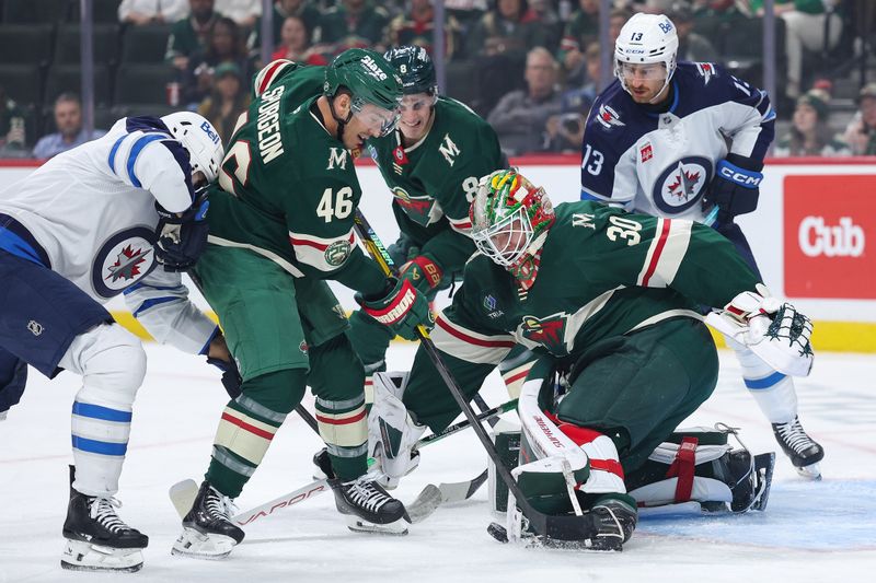 Sep 30, 2025; Saint Paul, Minnesota, USA; Minnesota Wild goaltender Jesper Wallstedt (30) makes a save against the Winnipeg Jets during the first period at Grand Casino Arena. Mandatory Credit: Matt Krohn-Imagn Images