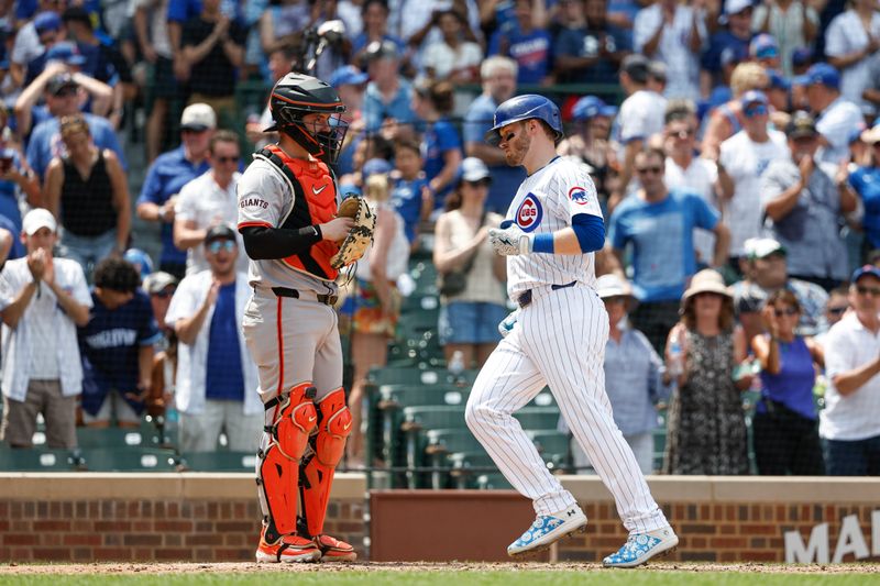 Jun 19, 2024; Chicago, Illinois, USA; Chicago Cubs outfielder Ian Happ (8) crosses home plate after hitting a solo home run against the San Francisco Giants during the fourth inning at Wrigley Field. Mandatory Credit: Kamil Krzaczynski-USA TODAY Sports