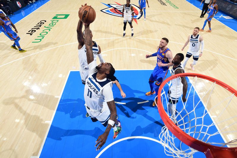 OKLAHOMA CITY, OK - MAY 22:  Naz Reid #11 of the Minnesota Timberwolves goes up for the rebound during the game against the Oklahoma City Thunder  during Game 2 of the Western Conference Finals  on May 22, 2025 at Paycom Center in Oklahoma City, Oklahoma. NOTE TO USER: User expressly acknowledges and agrees that, by downloading and or using this photograph, User is consenting to the terms and conditions of the Getty Images License Agreement. Mandatory Copyright Notice: Copyright 2025 NBAE (Photo by Garrett Ellwood/NBAE via Getty Images)