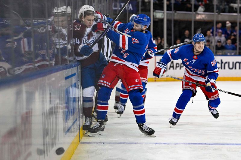 Feb 5, 2024; New York, New York, USA;  New York Rangers center Barclay Goodrow (21) checks Colorado Avalanche left wing Joel Kiviranta (94) during the third period at Madison Square Garden. Mandatory Credit: Dennis Schneidler-USA TODAY Sports