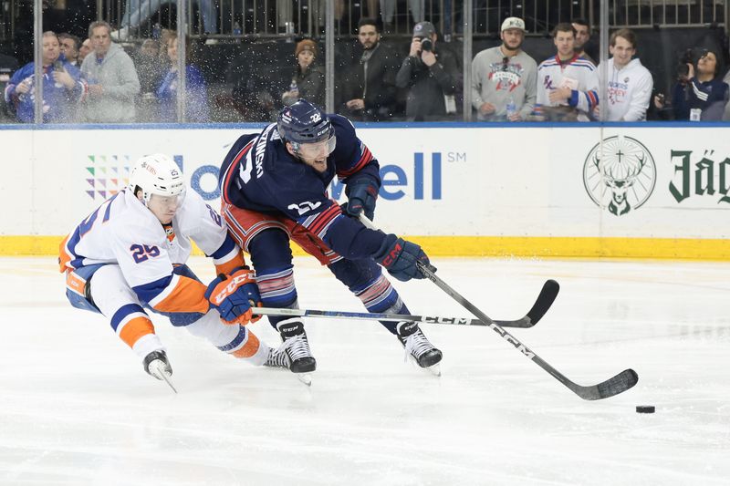 Mar 17, 2024; New York, New York, USA; New York Islanders defenseman Sebastian Aho (25) pokes the puck away from New York Rangers center Jonny Brodzinski (22) during the second period at Madison Square Garden. Mandatory Credit: Vincent Carchietta-USA TODAY Sports