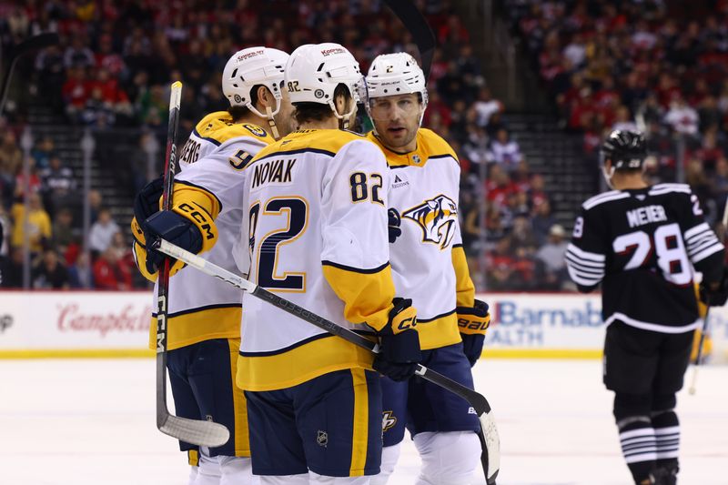 Nov 25, 2024; Newark, New Jersey, USA; Nashville Predators left wing Filip Forsberg (9) celebrates his goal against the New Jersey Devils during the first period at Prudential Center. Mandatory Credit: Ed Mulholland-Imagn Images