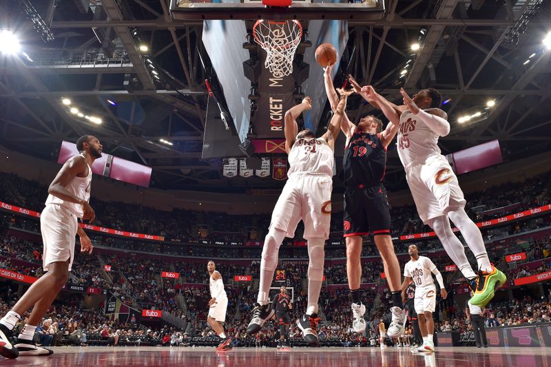 CLEVELAND, OH - NOVEMBER 24: Jakob Poeltl #19 of the Toronto Raptors shoots the ball during the game against the Cleveland Cavaliers on November 24, 2024 at Rocket Mortgage FieldHouse in Cleveland, Ohio. NOTE TO USER: User expressly acknowledges and agrees that, by downloading and/or using this Photograph, user is consenting to the terms and conditions of the Getty Images License Agreement. Mandatory Copyright Notice: Copyright 2024 NBAE (Photo by David Liam Kyle/NBAE via Getty Images)