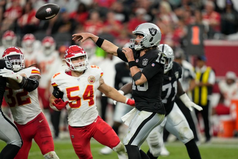 Las Vegas Raiders quarterback Gardner Minshew (15) throws during the second half of an NFL football game against the Kansas City Chiefs Sunday, Oct. 27, 2024, in Las Vegas. (AP Photo/John Locher)