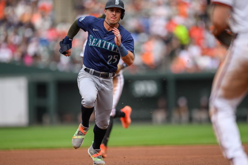 May 19, 2024; Baltimore, Maryland, USA; Seattle Mariners shortstop Dylan Moore (25) runs to third base during the seventh inning against the Baltimore Orioles at Oriole Park at Camden Yards. Mandatory Credit: Reggie Hildred-USA TODAY Sports