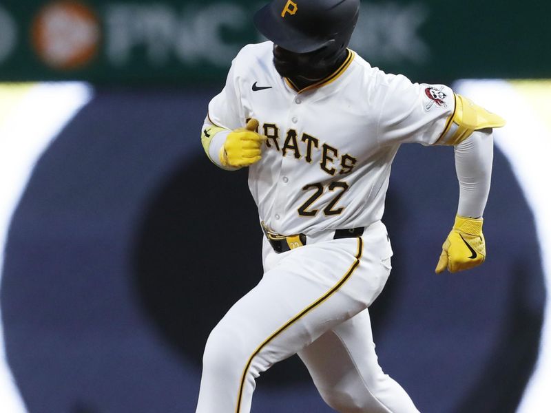 May 11, 2024; Pittsburgh, Pennsylvania, USA; Pittsburgh Pirates designated hitter Andrew McCutchen (22) runs the bases after hitting a solo home run against the Chicago Cubs during the sixth inning at PNC Park. Mandatory Credit: Charles LeClaire-USA TODAY Sports