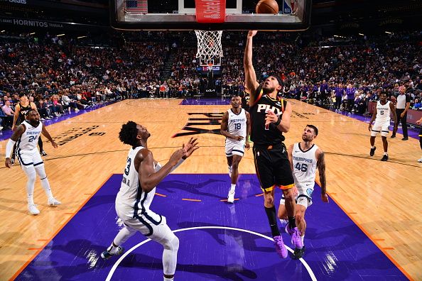 PHOENIX, AZ - DECEMBER 2: Devin Booker #1 of the Phoenix Suns drives to the basket during the game against the Memphis Grizzlies on December 2, 2023 at Footprint Center in Phoenix, Arizona. NOTE TO USER: User expressly acknowledges and agrees that, by downloading and or using this photograph, user is consenting to the terms and conditions of the Getty Images License Agreement. Mandatory Copyright Notice: Copyright 2023 NBAE (Photo by Barry Gossage/NBAE via Getty Images)