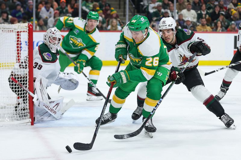 Jan 13, 2024; Saint Paul, Minnesota, USA; Minnesota Wild center Connor Dewar (26) skates with the puck alongside Arizona Coyotes defenseman Sean Durzi (50) during the second period at Xcel Energy Center. Mandatory Credit: Matt Krohn-USA TODAY Sports