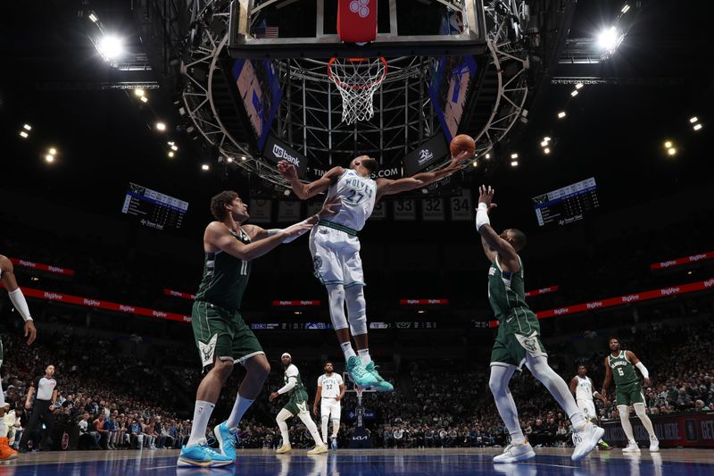 MINNEAPOLIS, MN -  FEBRUARY 23: Rudy Gobert #27 of the Minnesota Timberwolves goes for the ball during the game against the Milwaukee Bucks on February 23, 2024 at Target Center in Minneapolis, Minnesota. NOTE TO USER: User expressly acknowledges and agrees that, by downloading and or using this Photograph, user is consenting to the terms and conditions of the Getty Images License Agreement. Mandatory Copyright Notice: Copyright 2024 NBAE (Photo by Jordan Johnson/NBAE via Getty Images)