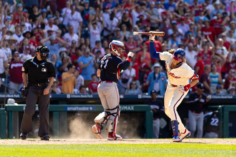 Aug 13, 2023; Philadelphia, Pennsylvania, USA; Philadelphia Phillies first baseman Alec Bohm (28) slams his bat to the ground in front of Minnesota Twins catcher Ryan Jeffers (27) after being called out on a strike by umpire Alex Mackay to end the seventh inning at Citizens Bank Park. Mandatory Credit: Bill Streicher-USA TODAY Sports