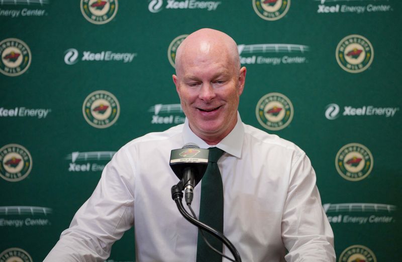 Nov 28, 2023; Saint Paul, Minnesota, USA;  Minnesota Wild head coach John Hynes talks to the media after a game against the St. Louis Blues at Xcel Energy Center. Mandatory Credit: Brad Rempel-USA TODAY Sports