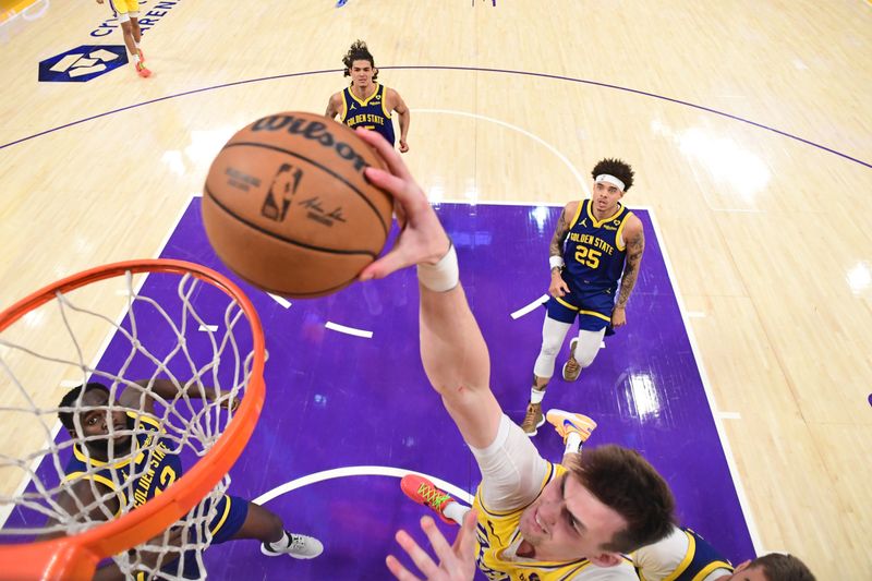 LOS ANGELES, CA - APRIL 9: Colin Castleton #14 of the Los Angeles Lakers dunks the ball during the game against the Golden State Warriors on April 9, 2024 at Crypto.Com Arena in Los Angeles, California. NOTE TO USER: User expressly acknowledges and agrees that, by downloading and/or using this Photograph, user is consenting to the terms and conditions of the Getty Images License Agreement. Mandatory Copyright Notice: Copyright 2024 NBAE (Photo by Adam Pantozzi/NBAE via Getty Images)