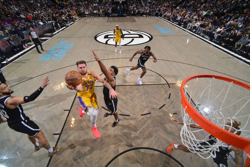 BROOKLYN, NY - MARCH 10: Luka Doncic #77 of the Los Angeles Lakers drives to the basket during the game against the Brooklyn Nets on March 10, 2025 at Barclays Center in Brooklyn, New York. NOTE TO USER: User expressly acknowledges and agrees that, by downloading and or using this Photograph, user is consenting to the terms and conditions of the Getty Images License Agreement. Mandatory Copyright Notice: Copyright 2025 NBAE (Photo by Jesse D. Garrabrant/NBAE via Getty Images)