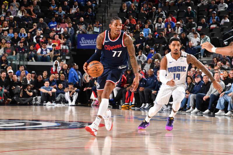 INGLEWOOD, CA - NOVEMBER 20: Kevin Porter Jr. #77 of the LA Clippers dribbles the ball during the game against the Orlando Magic on November 20, 2024 at Intuit Dome in Los Angeles, California. NOTE TO USER: User expressly acknowledges and agrees that, by downloading and/or using this Photograph, user is consenting to the terms and conditions of the Getty Images License Agreement. Mandatory Copyright Notice: Copyright 2024 NBAE (Photo by Juan Ocampo/NBAE via Getty Images)