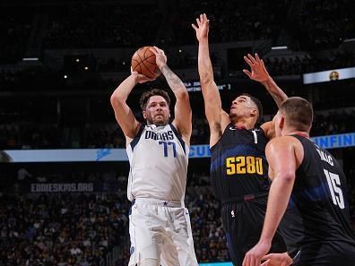 DENVER, CO - DECEMBER 18: Luka Doncic #77 of the Dallas Mavericks shoots the ball during the game against the Denver Nuggets on December 18, 2023 at the Ball Arena in Denver, Colorado. NOTE TO USER: User expressly acknowledges and agrees that, by downloading and/or using this Photograph, user is consenting to the terms and conditions of the Getty Images License Agreement. Mandatory Copyright Notice: Copyright 2023 NBAE (Photo by Bart Young/NBAE via Getty Images)