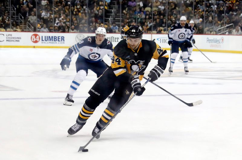 Jan 13, 2023; Pittsburgh, Pennsylvania, USA;  Pittsburgh Penguins defenseman Jan Rutta (44) handles the puck against the Winnipeg Jets during the second period at PPG Paints Arena. The Jets won 4-1. Mandatory Credit: Charles LeClaire-USA TODAY Sports