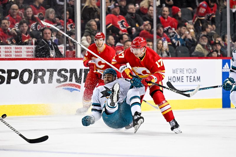 Feb 15, 2024; Calgary, Alberta, CAN; San Jose Sharks right wing Justin Bailey (90) is taken down by Calgary Flames center Yegor Sharangovich (17) during the first period at Scotiabank Saddledome. Mandatory Credit: Brett Holmes-USA TODAY Sports