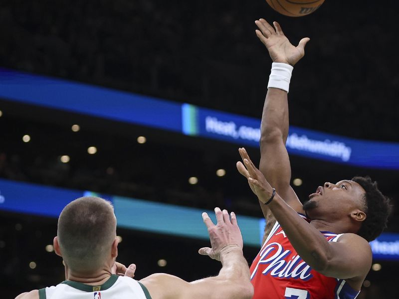 BOSTON, MA - FEBRUARY 27  Kyle Lowry #7 of the Philadelphia 76ers shoots over Kristaps Porzingis #8 of the Boston Celtics in the first quarter of a game at TD Garden on February 27, 2024 in Boston, Massachusetts. NOTE TO USER: User expressly acknowledges and agrees that, by downloading and or using this photograph, User is consenting to the terms and conditions of the Getty Images License Agreement. (Photo by Adam Glanzman/Getty Images)